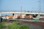 A Westbound Stack Train Passes under First Street